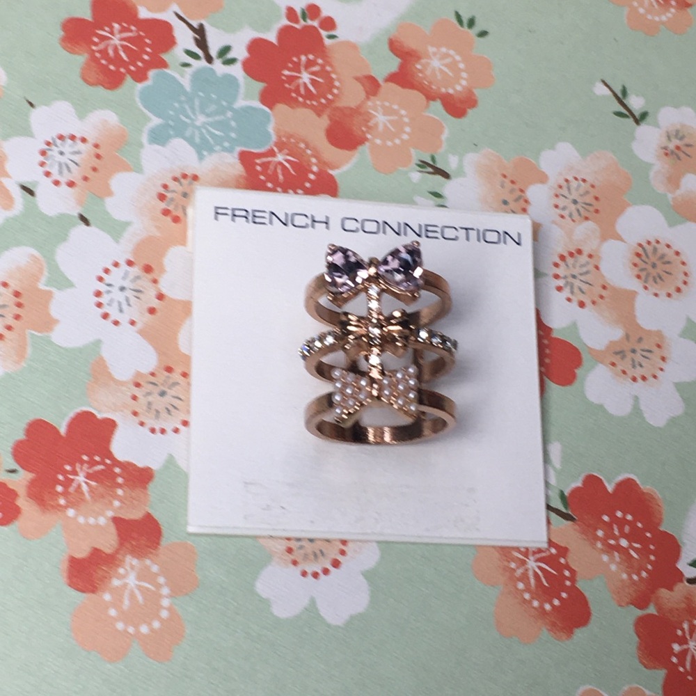 French Connection Rose Gold Ring Sz 7 Three permanently stacked jeweled gem bow